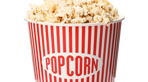 Paper bucket with of tasty popcorn on white background