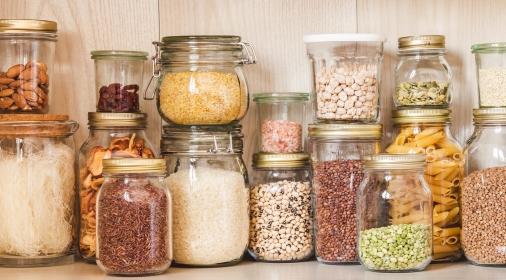 Shelf in the kitchen with various cereals and seeds