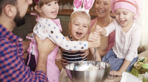 Parents and their children baking together