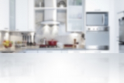 Empty kitchen countertop with defocused modern kitchen background