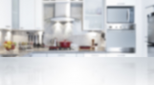 Empty kitchen countertop with defocused modern kitchen background