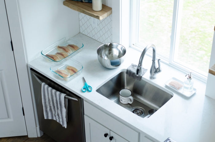 kitchen sink with mug and tea towel