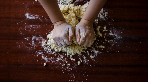 Someone kneading dough