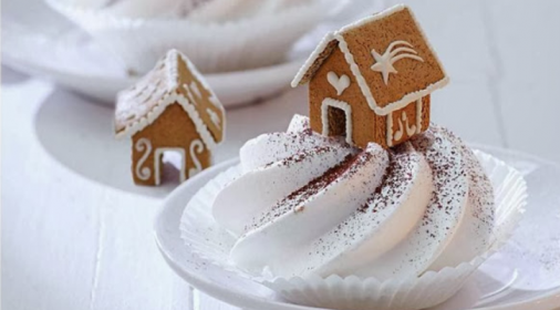 Gingerbread house on top of cream